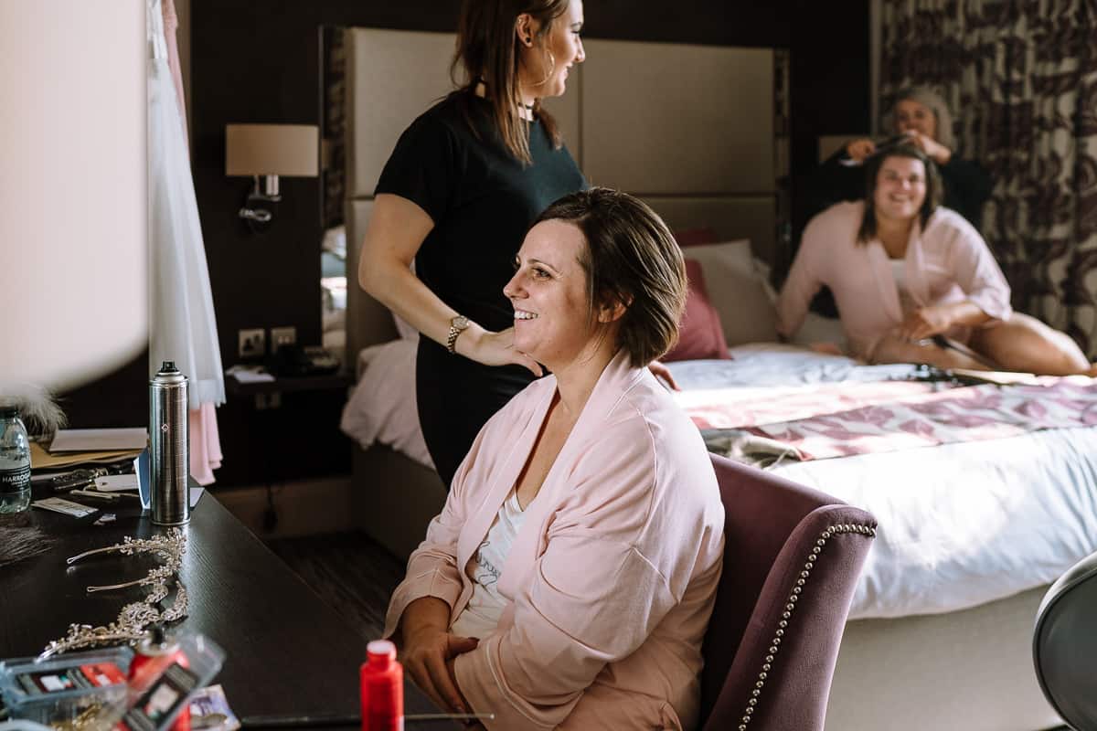 Bride smiling at Abbey House Hotel, Barrow in Furness during Bridal Preparations