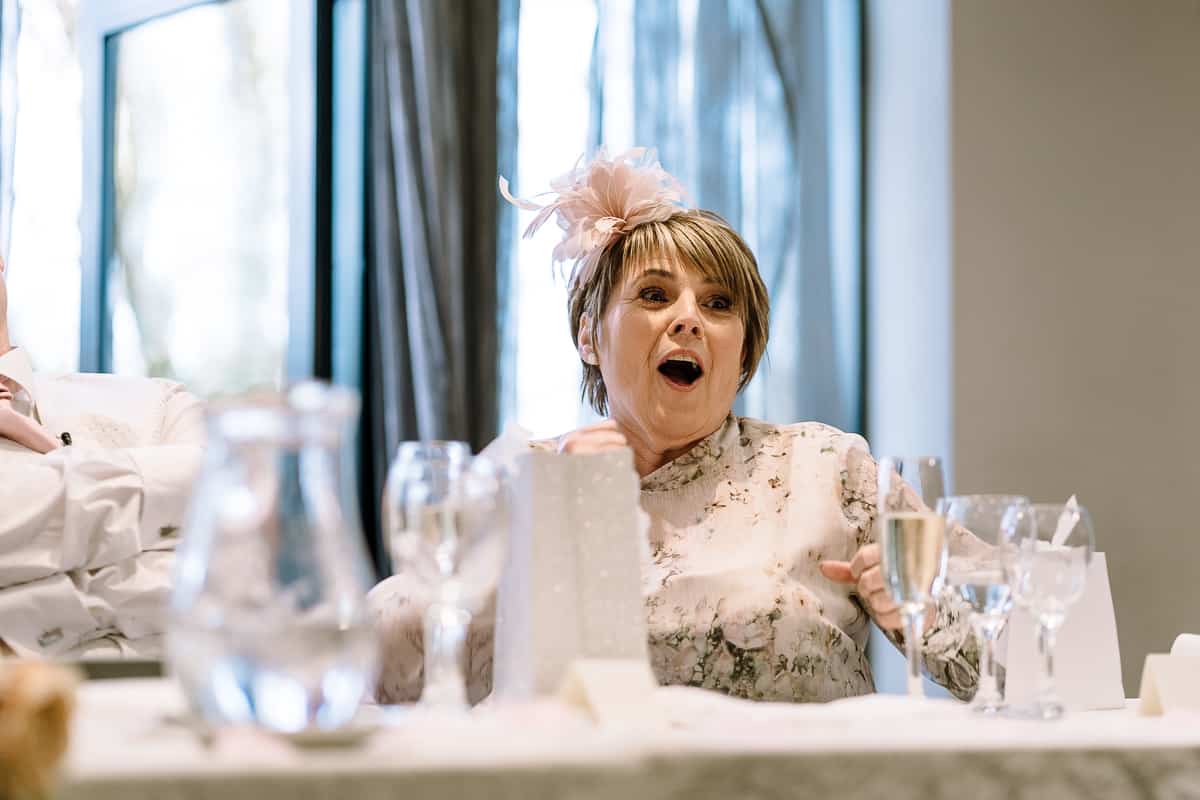 Mother of the bride's reactions during the speeches at Abbey House Hotel wedding in Barrow, South Lakes