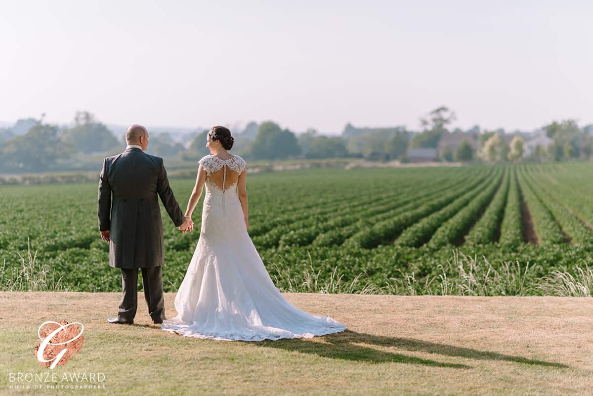 Bride and Groom standing in the evening sun at the West Tower Exclusive Wedding Venue in Ormskirk