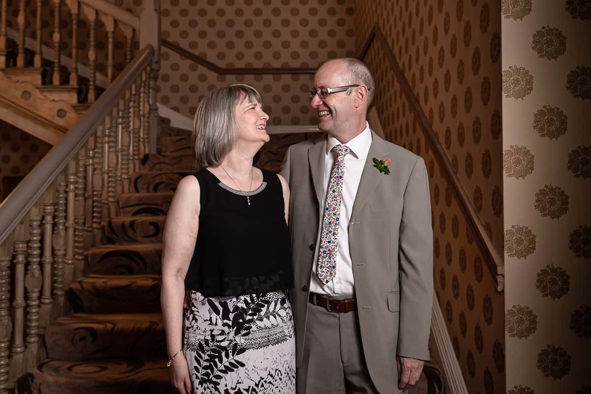 Happy couple on the staircase at the Grosvenor Hotel Chester